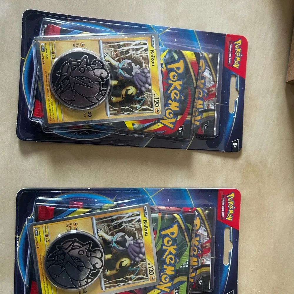 Lot of 10 Pokémon TCG booster double pack with two packs inside featuring Raikou